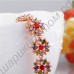 Запоминающийся позолоченный браслетик с цветочками из разноцветных фианитов